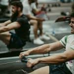 men rowing at gym