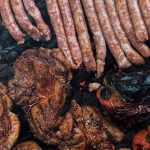 roasting meat and sausages on barbecue grid