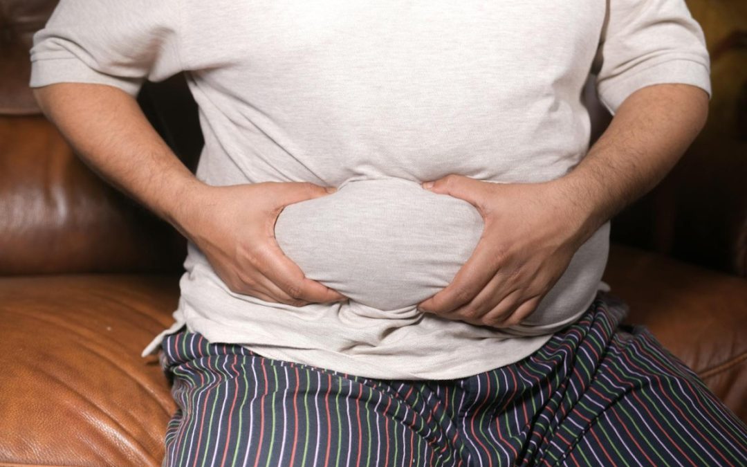 A Man Holding His Tummy